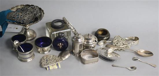 A group of mixed silver including condiments, napkin rings, scents, belt buckles etc.